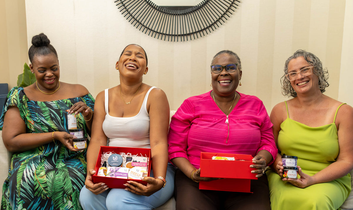 4 women gifting and using natural soaps lotions body oil to each other