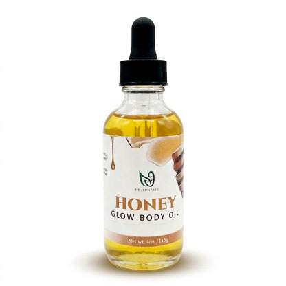 Bottle of honey glow body oil with a glass dropper bottle on a white background