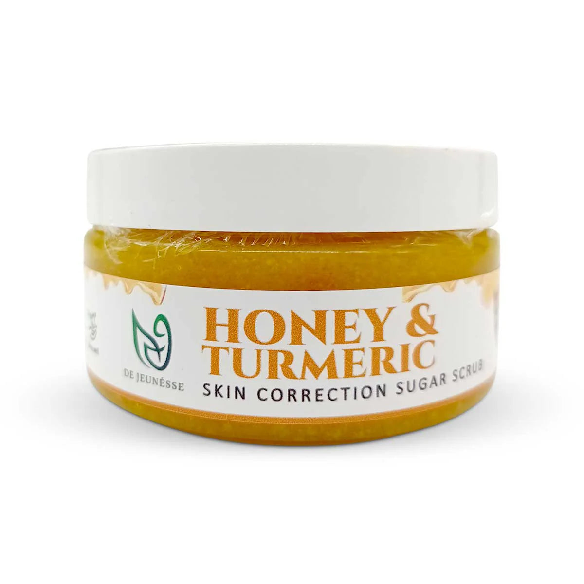 Jar of honey and turmeric skin correction sugar scrub with a white label on a white background